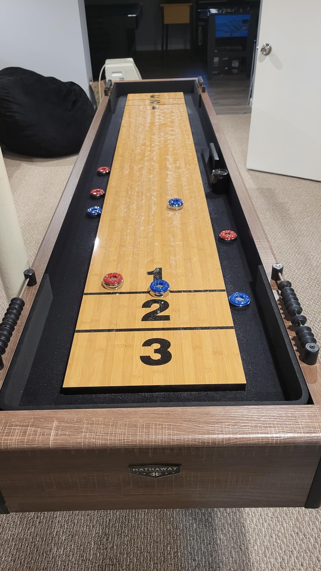 Hathaway Excalibur 9-Ft Shuffleboard Table for Great for Family Recreation Game Rooms, Designed with a Rustic Driftwood Finish with Built-In Leg Levelers, Includes 8 Pucks, Table Brush and Wax | Poly-coated playfield, X-pattern base, 8 weighted pucks, dual abacus scorers, brush, wax, driftwood finish, for 2-4 players customer photo 1