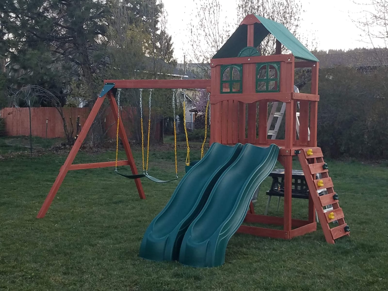 Gorilla Playsets Playmaker Deluxe Wooden Swing Set with Vinyl Canopy Roof, Dual Wave Slides, and Rock Climbing Wall, Redwood Stained Cedar customer photo 1